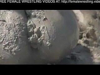 Girls wrestling in make an issue of mud